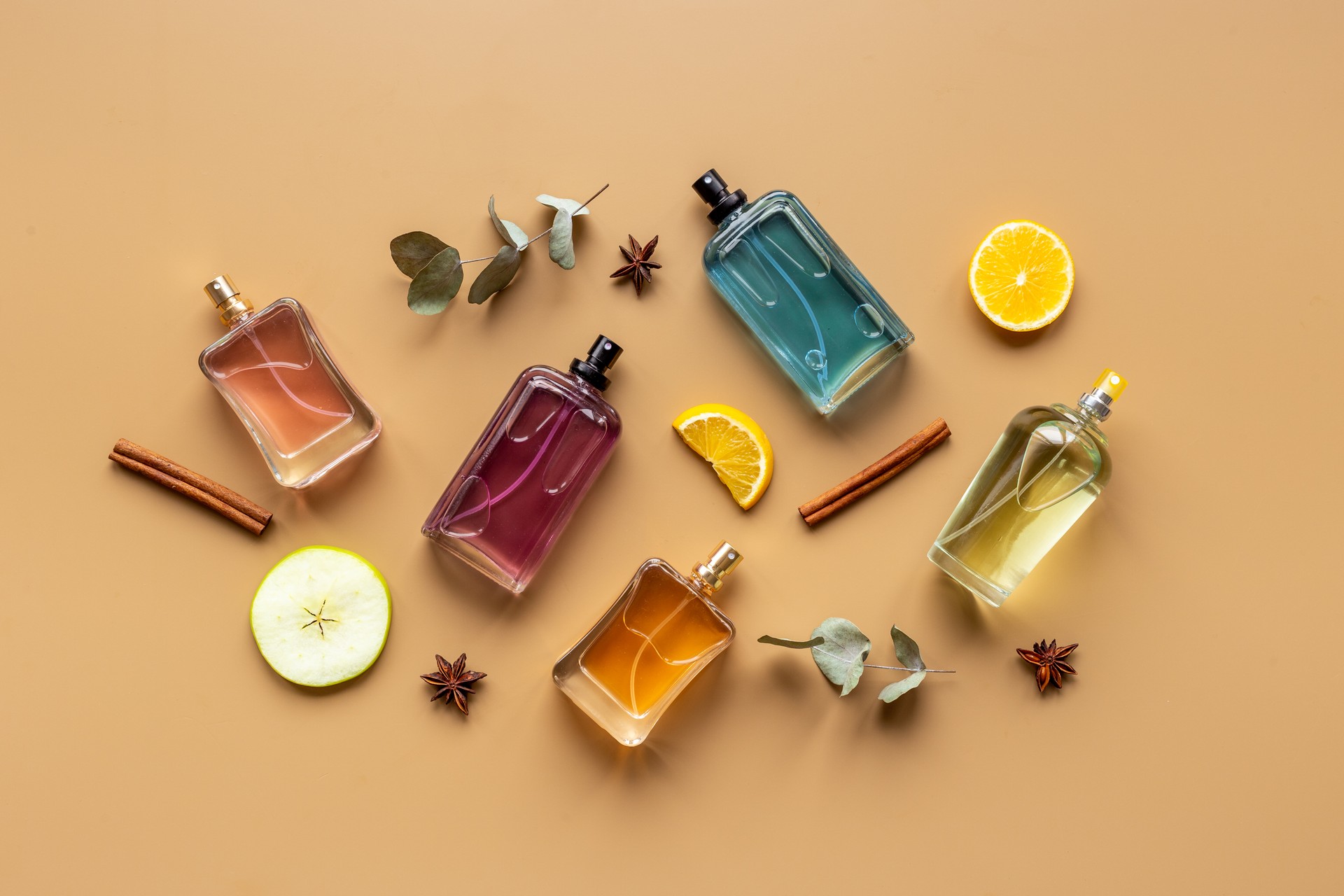 Set of perfume bottles with fragrance spaces and fruits